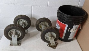 lot 365 image: Lot of Four 8 Diameter Wheels on Casters with a 5 Gallon Bucket