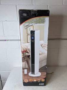 lot 329 image: Optimus 29 in. Oscillating Tower Ceramic Heater with Remote Control
