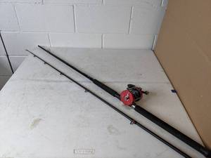 lot 271 image: Abu Garcia Ambassadeur 7000 RH 8 Rod and Spincast Reel Combo