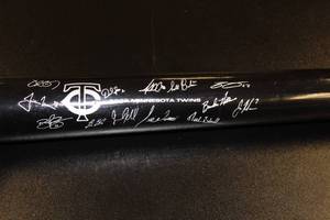 lot 33 image: Minnesota Twins 2009 Facsimile SGA Commemorative Bat