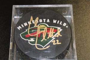 lot 81 image: Minnesota Wild Cal Clutterbuck Autograph Hockey Puck