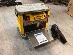 lot 10 image: DEWALT 15 Amp Corded 12-12 in. Planer CUSTOMER RETURNS SEE PICTURES