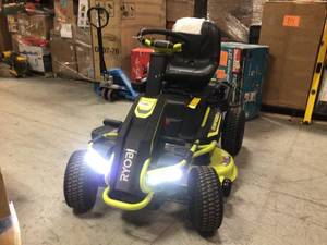 lot 15 image: 48V Brushless 38 in. 75 Ah Battery Electric Rear Engine Riding Lawn Mower by RYOBI - includes a battery but no charger  Customer Returns See Pictures