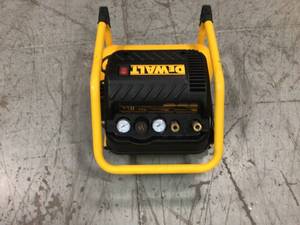 lot 18 image: 2.5 Gal. Portable Electric Heavy Duty 200 PSI Quiet Air Compressor by DEWALT Customer Returns See Pictures