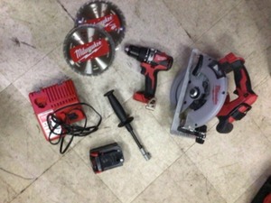 lot 6 image: Milwaukee M18 18-Volt Lithium-Ion Brushless Cordless Hammer Drill and Circular Saw Combo Kit (2-Tool) with a battery and charger in good working condition