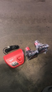 lot 33 image: Milwaukee M12 12-Volt Lithium-Ion Starter Kit with Two 6.0 Ah Battery Packs and Charger