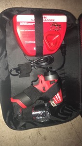 lot 34 image: Milwaukee M12 FUEL 12-Volt Lithium-Ion Brushless Cordless 14 in. Hex Impact Driver Kit with One 2.0 Ah Battery, Charger and Bag