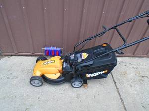 Worx cordless mower for parts or repair. Battery shows good. No charger included. As shown.