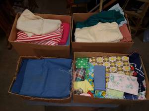 4 Boxes of Various Sizes of Fabric, Quilting and Clothing Supplies