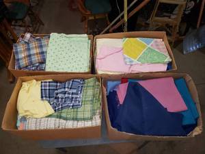 4 Boxes of Various Sizes of Fabric, Quilting and Clothing Supplies