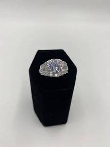 lot 15 image: Silver Wedding Type Ring with Bigger Stone in the Middle and 3 Rows of Smaller Rhinestones