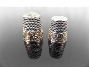 lot 38 image: 2 Antique Simons Brothers Gold Rimmed .925 Sterling Silver Thimbles