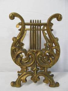 lot 10 image: Vintage Gilt Cast Iron Musical Magazine Rack