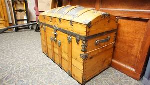 Beautiful Wooden Trunk W Black Leather On Top--Has Handles & Ornamental Trimmings On It--Has Lock--Neat & Clean Inside--Has Horse & Rider & Dog Picture On Inside Top Lid--On Casters