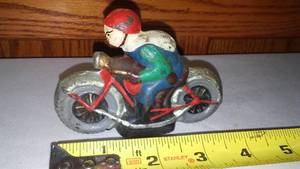 lot 154 image: Cast Motorcycle and Rider.