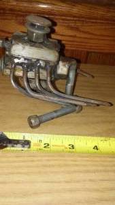 lot 231 image: Metal Artwork V8 Motor on Engine Stand.