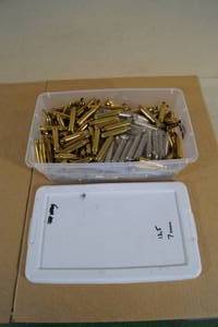 Bin of Empty 7mm Rem Mag Casings