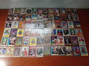 lot 16 image: 8 Pages of HOFer Cal RipkenOzzie Smith Cards