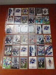 lot 35 image: 4 Pages of Tom Brady Cards