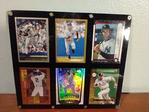 lot 70 image: 6 Derek Jeter Cards in Card Plaque