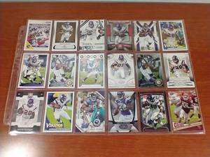 lot 83 image: 2 Pages of Adrian Peterson Cards