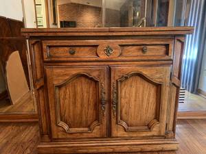 Charming Credenza Opens to Wide Bar for Entertaining