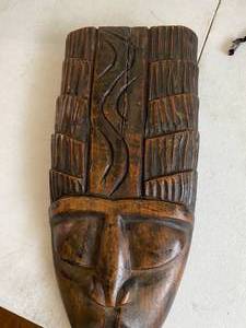 Carved Wood and Woven Straw Masks