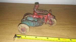 lot 19 image: Antique cast motorcycle and sidecar. Cop