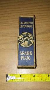 lot 28 image: Vintage champion spark plug in box.