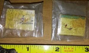 lot 37 image: 2 pheasant pins. New in bags.