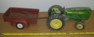 lot 53 image: ERTL Deere tractor and pickup box trailer.