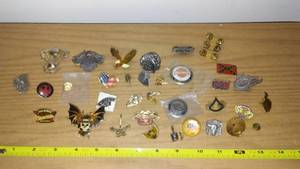 lot 125 image: Harley-Davidson, Indian pins and more. Huge lot.