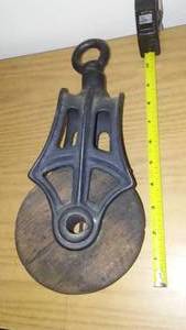 lot 128 image: Vintage pulley wheel- block.