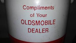 lot 146 image: Oldsmobile Coleman cooler.