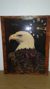 lot 206 image: Eagle clock. 24 X 19, requires 1C battery.