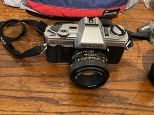 lot 24 image: Minolta Cameras, Lenses and Case