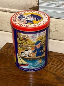 lot 28 image: Variety of Tin Canisters Cracker Jack, Wilburs Breakfast Cocoa, Sunkist California Dream, Boy Scouts