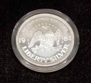 lot 15 image: 1 TROY OZ .999 FINE SILVER 1984 A-MARK LIBERTY IN AIRTITE