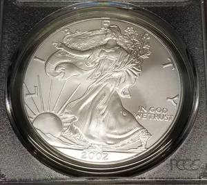 lot 16 image: 2002 AMERICAN SILVER EAGLE 1 TROY OZ .999 FINE SILVER MS69 PCGS