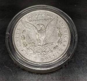 lot 39 image: 1886 MORGAN SILVER DOLLAR IN AIRTITE