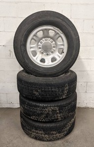 lot 127 image: (Set of 4 Tires) 2016 Michelin LTX AT LT26570R18, Load Range E on GM 8x180 Steel Rims
