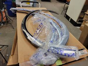 lot 420 image: NOS - Genuine Ford 2015 to 2018 F150 Stainless Steel Fender Trim Kit - Part No. VGL3Z-16268-A