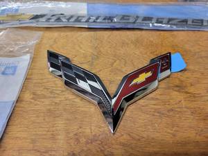 lot 588 image: NOS - Genuine GM Emblems - Corvette, Trail Blazer, Pontiac, Traverse and More