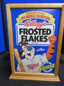 lot 36 image: MINNESOTA TWINS LIMITED EDITION FROSTED FLAKES BOX IN BEAUTIFUL 2 SIDED PLEXI  WOOD DISPLAY CASE.
