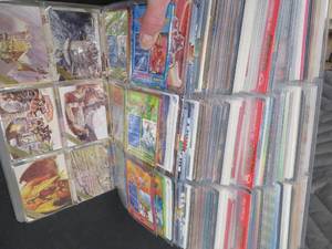 lot 114 image: LARGE BOOK FILLED WITH YU-GI-OH  MISC. COLLECTABLE CARDS.