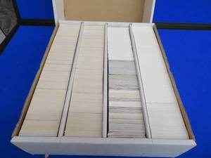 lot 147 image: 4 ROW BOX OF MINT, RAW, UNLOOKED AT CARDS.