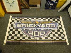 lot 50 image: INDIANAPOLIS MOTOR SPEEDWAY - BRICKYARD 100% POLYESTER BANNER - APPROX 64 BY 36 - GREAT PIECE - SEE PICTURES