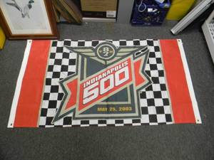 lot 51 image: INDIANAPOLIS MOTOR SPEEDWAY - INDIANAPOLIS 500 100% POLYESTER BANNER - APPROX 64 BY 36 - GREAT PIECE - SEE PICTURES