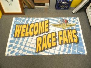 lot 52 image: INDIANAPOLIS MOTOR SPEEDWAY - INDIANAPOLIS 500 WELCOME RACE FANS 100% POLYESTER BANNER - APPROX 64 BY 36 - GREAT PIECE - SEE PICTURES