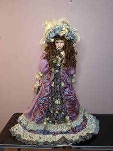 lot 51 image: Lovely China Doll in Fancy Dress on a Stand